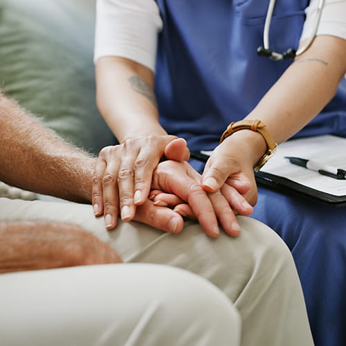 woman holding persons hands