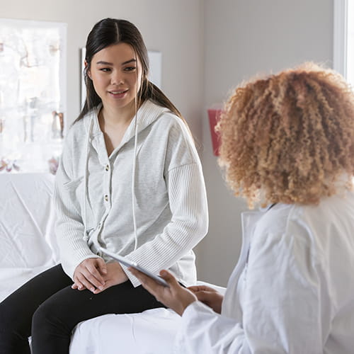 woman talking to doctor