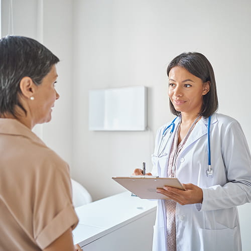 woman talking to doctor