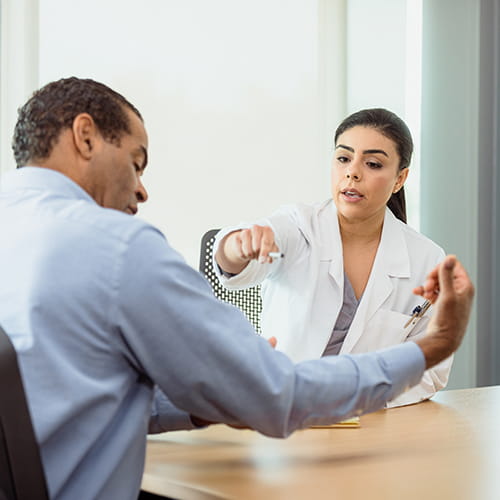 doctor examining man