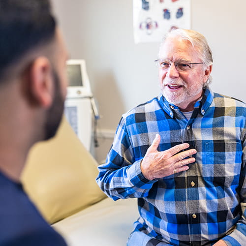 older man talking to doctor