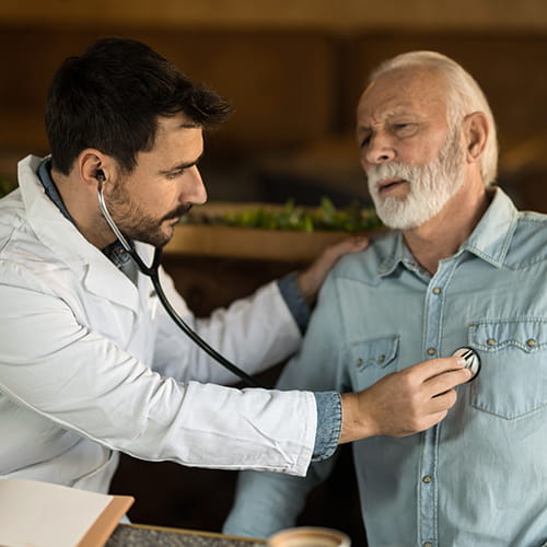 doctor listening to patients heart