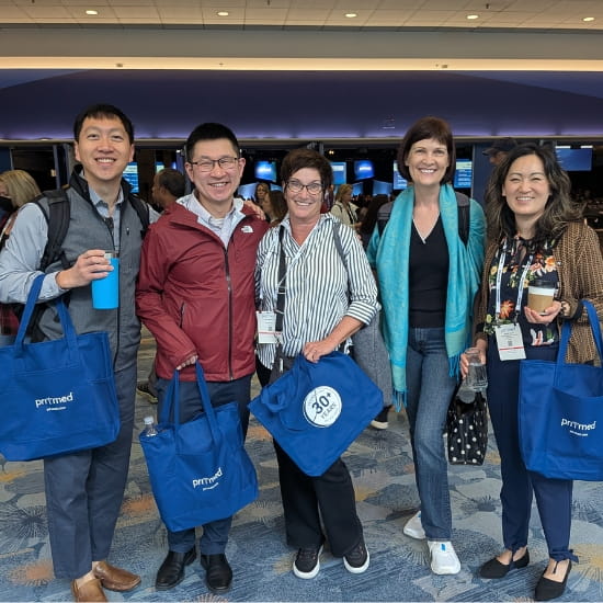 attendees smiling at pri-med conference