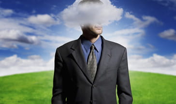 suited man with his head in a cloud
