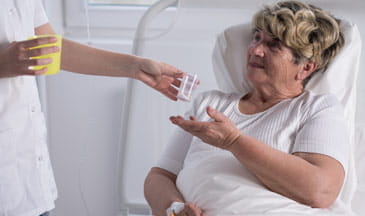 female patient receiving medication